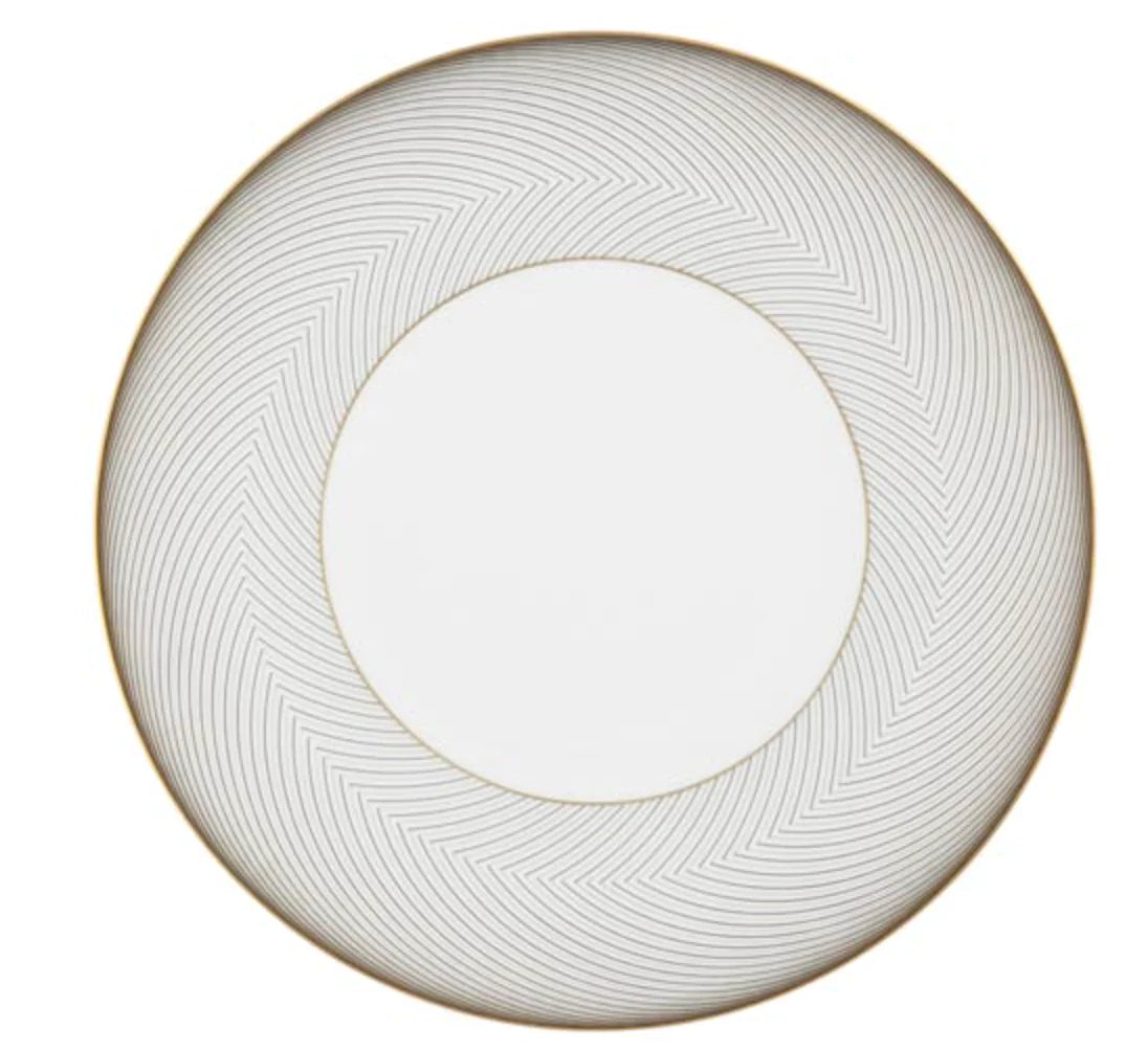The Oskar Dinnerware by Raynaud is a round, white plate with a wide gold and gray chevron-patterned border and thin gold rim. The plain white center highlights its geometric-inspired elegance—a standout Raynaud piece.