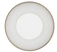 The Oskar Dinnerware by Raynaud is a round, white plate with a wide gold and gray chevron-patterned border and thin gold rim. The plain white center highlights its geometric-inspired elegance—a standout Raynaud piece.
