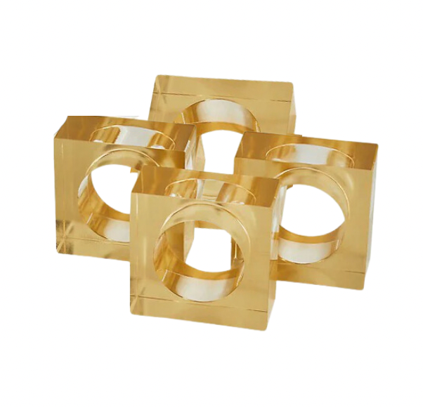 The Tizo Lucite Cube Napkin Ring Set of 4 features gold-colored, square acrylic rings with large circular cutouts—elegant accents to elevate your modern table decor.