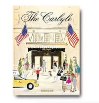 Illustrated cover of Assouline's "The Carlyle" book features the iconic hotel entrance with doormen, guests, a yellow taxi, U.S. flags, and lively scenes. The title appears in elegant script at the top.