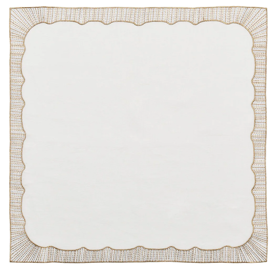 Elevate your table with the Kim Seybert Frame White, Gold & Silver Napkin Set of 4, featuring white linen and a metallic embroidered border for timeless sophistication. Discover elegance in every detail.