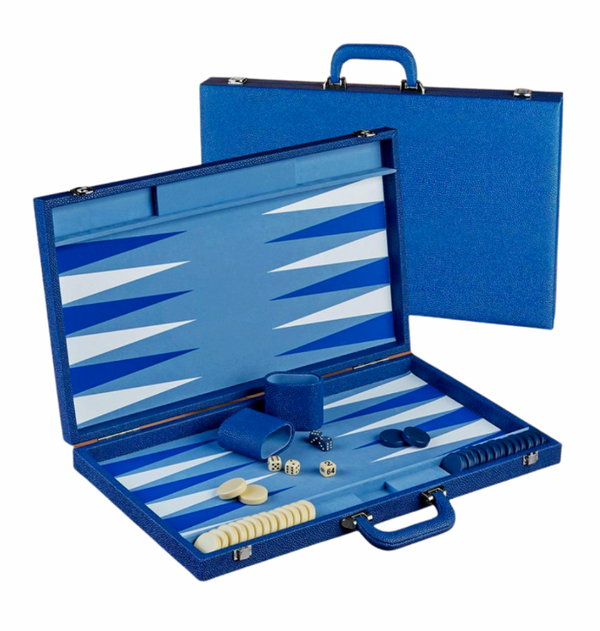 The Onyx Pebble Blue Backgammon Set by Brouk & Co is shown both open and closed, featuring blue and white points, game pieces, and dice.