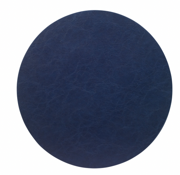 A round, dark blue vegan leather placemat with a textured finish, photographed on a white background—stylish and easy to care for.
