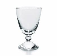The Baccarat Vega Water Glass features a clear, wide-bowled goblet artfully set on an inverted glass base, standing out as a luxurious and unique piece—ideal for those who appreciate fine glassware.