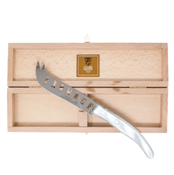 The Claude Dozorme Berlingot Fromage Cheese Knife features “FROMAGE” cut out on its stainless steel blade and comes displayed on a wooden box with a hinged lid and gold clasp.