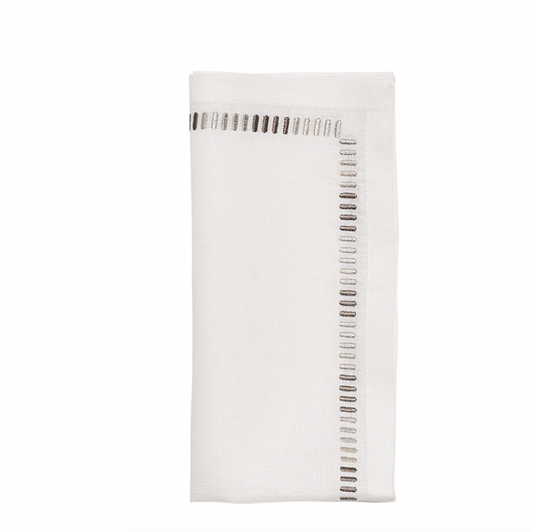 The Kim Seybert Harmonie Napkin in White, Gray & Silver features neatly folded white linen with small embroidered dashes in gray and taupe along two edges. Set of 4.