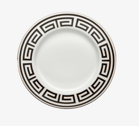 The Labirinto Dinnerware Nero by Ginori 1735 is a round, white porcelain plate featuring a striking black Greek key pattern around the rim, shown on a plain white background.