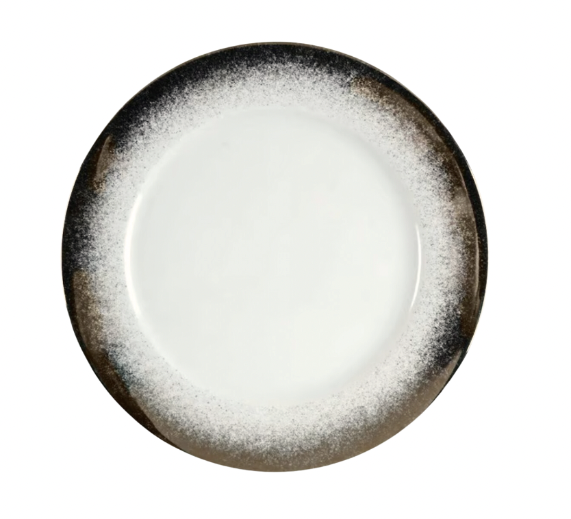 The Feux Platinum Charger by Royal Limoges is an 11.75-inch round porcelain plate featuring a white center and a dark, speckled rim that fades from black to brown, shown empty against a white background.