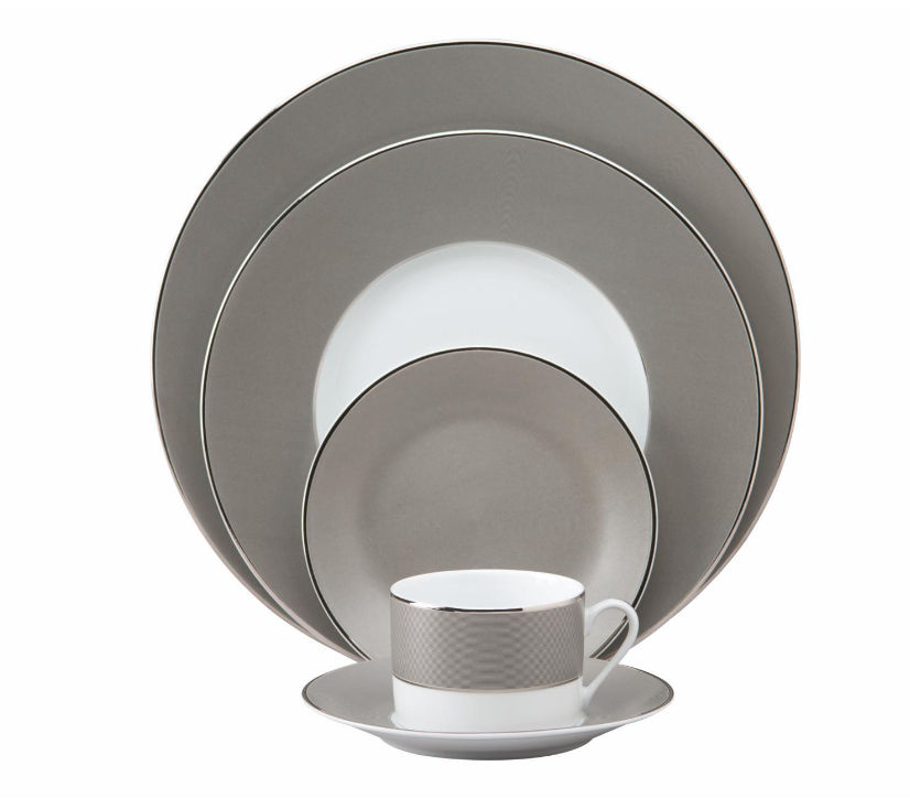 The Philippe Deshoulieres BIA Metallic Presentation Plate is a formal Limoges porcelain piece featuring a sleek gray and white design with silver rims, offering an elegant touch to your dinnerware collection.