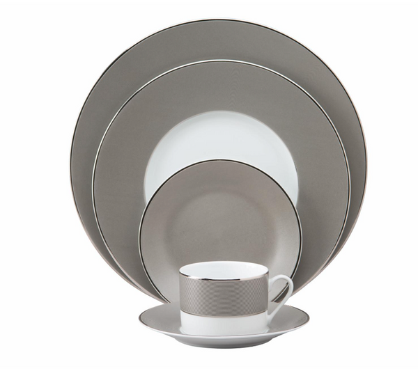 The Philippe Deshoulieres BIA Metallic Presentation Plate is a formal Limoges porcelain piece featuring a sleek gray and white design with silver rims, offering an elegant touch to your dinnerware collection.