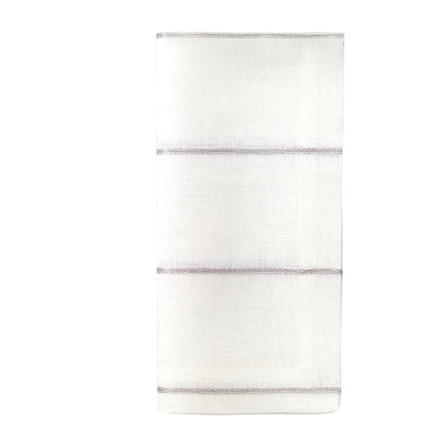 A set of four soft white linen napkins from Bodrum, each featuring three evenly spaced thin silver metallic stripes.