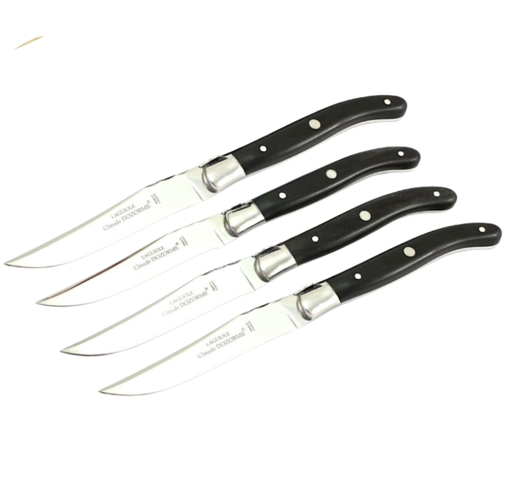 Four stainless steel knives with black handles and silver rivets from the Claude Dozorme Laguiole Steak Knives Set are aligned on a white background, highlighting their modern design and classic French craftsmanship.