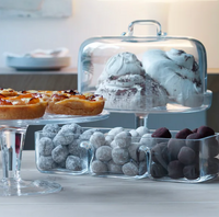 A selection of pastries and sweets, including tarts and powdered pastries, displayed alongside assorted confections in the LSA Serve Handmade Trio Dish.