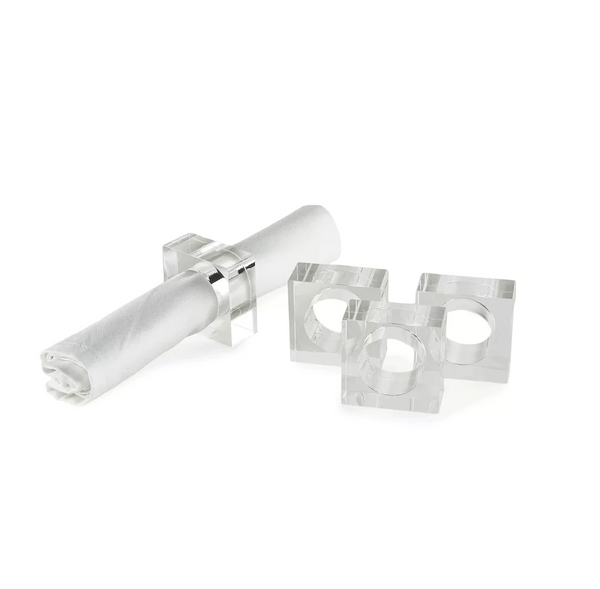 The Tizo Lucite Cube Napkin Ring Set of 4 features modern, clear rectangular acrylic rings—one displayed with a rolled white napkin, the other empty—adding an elegant accent to your table decor.
