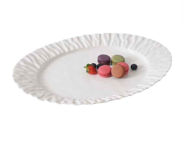 The PAMPA BAY Mascali Bianca Serving Platter, featuring a white porcelain design with ruffled edges, displays assorted colorful macarons, a strawberry, blueberry, and blackberry at the center on a white background.