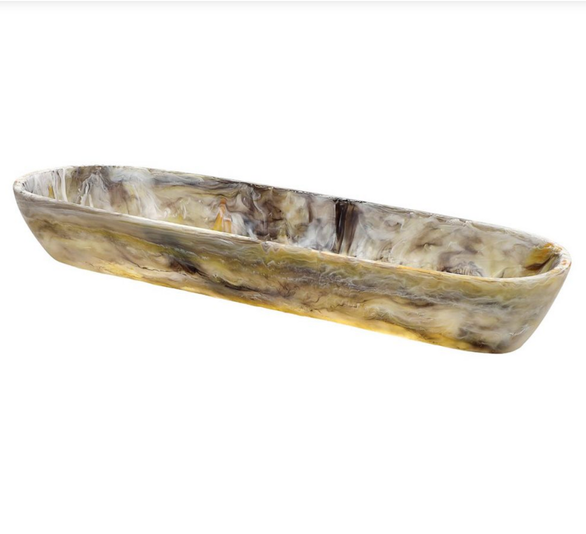 The Nashi Home Swirl Resin Colored Boat Bowl Mocha features a long, shallow design with a marbled mocha pattern. Made from glossy, shatter-resistant resin, it's the perfect accent for your home décor.