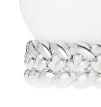 A close-up of the Babylone Vase by Christofle, handmade in France, featuring white porcelain on a silver-plated base with a rounded leaf or petal pattern.
