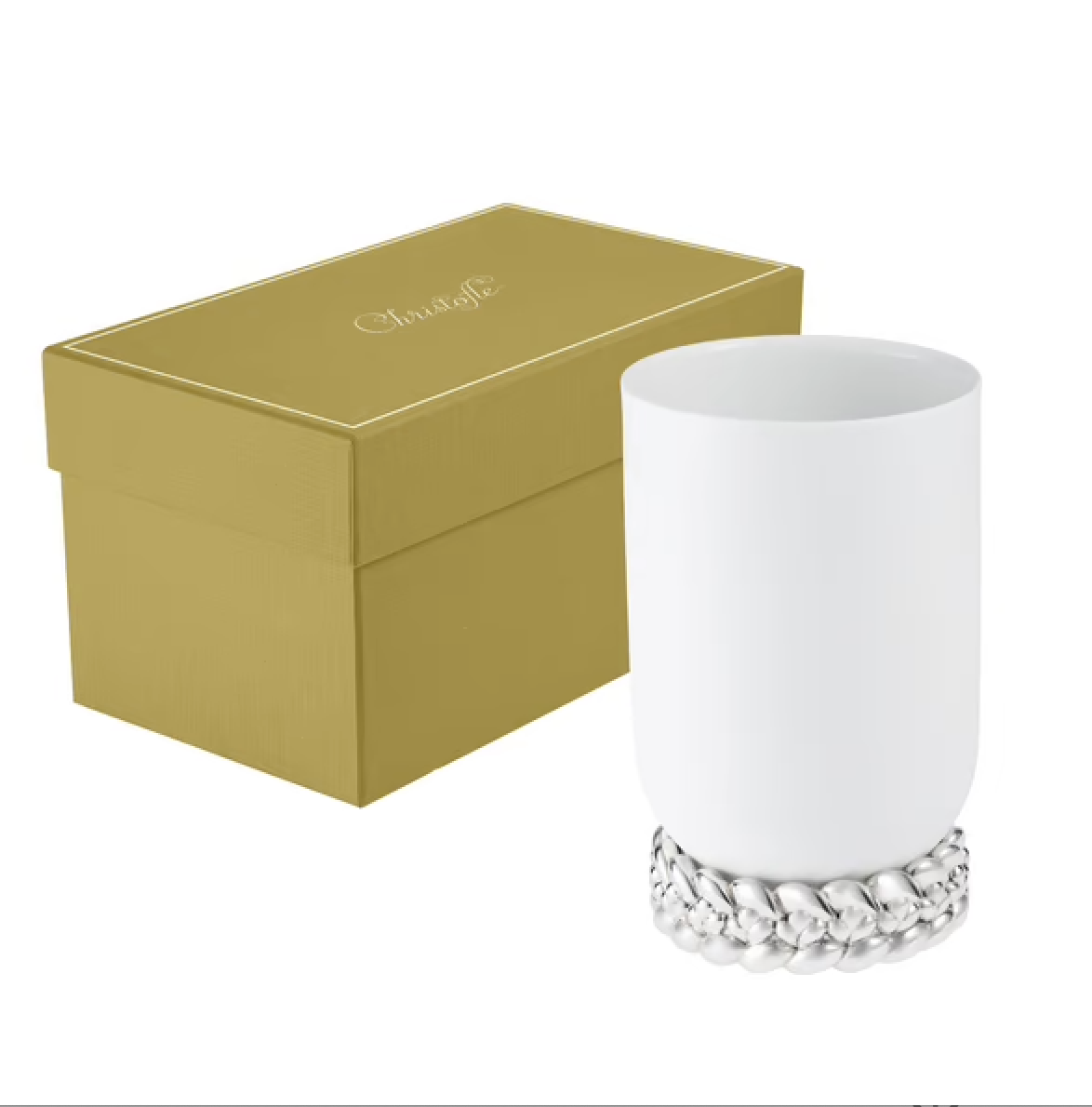 The Babylone Vase by Christofle, a handmade white porcelain tumbler with a silver-plated base, is displayed beside a gold Christofle gift box on a white background.