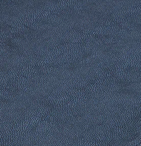 Close-up of the Stingray Handle Tray by Bodrum, showcasing its dark blue textured surface with evenly distributed small, rounded bumps that create a stippled look and evoke the tray’s sleek design with silver handles.