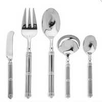 The Ricci Castello 5 Piece Hostess Set includes polished stainless steel flatware with ribbed bamboo-style handles: a knife, fork, large spoon, ladle, and small spoon—ideal for an elegant dinner party display.