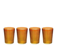 The Prism Highball Set of 4 by L'Objet features amber-colored glasses with vertical ribbed patterns. These stylish, dishwasher-safe tumblers are arranged in a row against a white background, combining elegance and convenience for everyday use.
