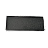 The Bold Decor Victoria Long Rectangle Serving Tray is a black, textured vinyl tray with slightly raised edges, shown on a plain white background.