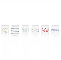 The Ichendorf Milano Deco Arlecchino Water Glass Set of 6 features clear glasses, each adorned with a unique pattern—rings, lines, swirls, waves, loops, and dots—adding style to your table.