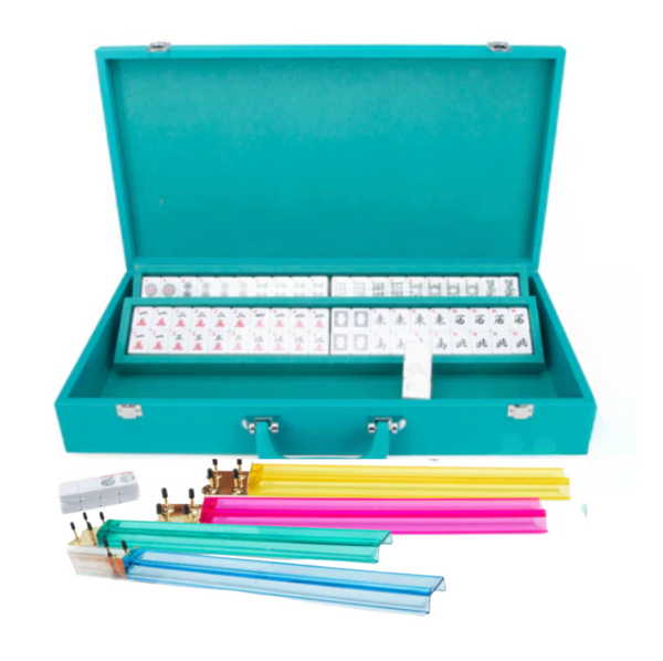 The Brouk & Co Ellen Mahjong Set - Teal features an open case with tiles, a dice tube, blue, green, yellow, and pink racks, plus a portable vegan leather scoring stick holder and point counters displayed in front.
