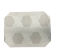 The Julian Mejia Reversible Cut Corner Placemat Set of 4 in Sisal features a light grey geometric pattern, perfect for modern table decor and everyday dining.