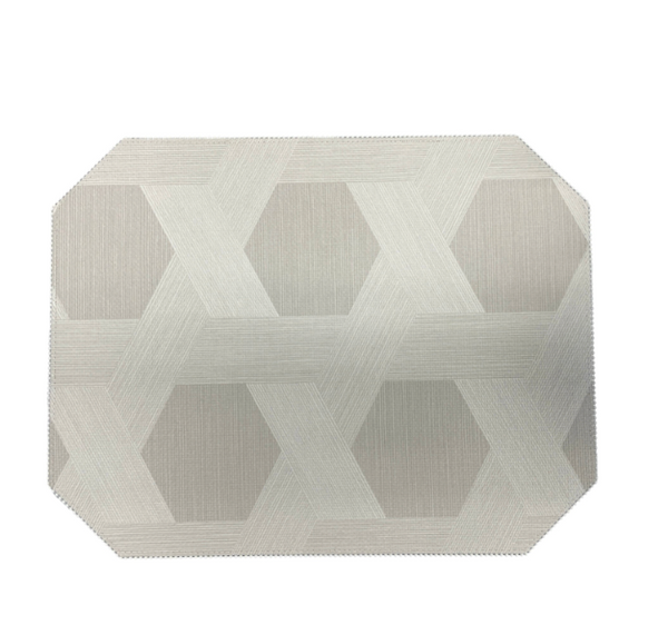 The Julian Mejia Reversible Cut Corner Placemat Set of 4 in Sisal features a light grey geometric pattern, perfect for modern table decor and everyday dining.
