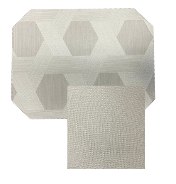 The Julian Mejia Reversible Cut Corner Placemat Set of 4 in Sisal features a modern rectangular design and subtle pattern, perfect for stylish table decor.