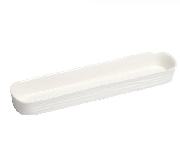 The PAMPA BAY Le Blanc Cracker Tray is a long, narrow white porcelain tray with gently curved sides and a wavy textured exterior—ideal as a stylish serving or cracker tray for any occasion.