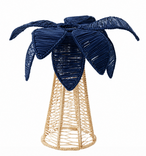 The Palm Tree Candle Holder - Navy - Medium by Coro Cora is handmade in Colombia from Iraca palm, featuring a woven beige base and navy wicker leaves—ideal paired with other woven candle holders.