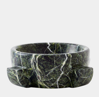 The Ravine Marble Dome Bowl 9″ by Global Views / Surya is a round, dark green rainforest marble bowl adorned with white veins and two rectangular handles on opposite sides, displayed against a plain light gray background. This decorative piece blends elegance with functionality, serving as a striking accent for any space.