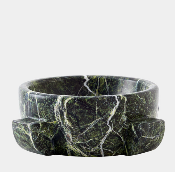 The Ravine Marble Dome Bowl 9″ by Global Views / Surya is a round, dark green rainforest marble bowl adorned with white veins and two rectangular handles on opposite sides, displayed against a plain light gray background. This decorative piece blends elegance with functionality, serving as a striking accent for any space.