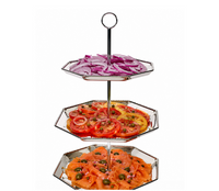 The Juliska Graham 3 Tier Server creates an elegant appetizer display—arrange sliced red onions on the top tier, assorted sliced tomatoes in the middle, and smoked salmon with capers and onions on the bottom tier—to beautifully elevate your home décor at any gathering.