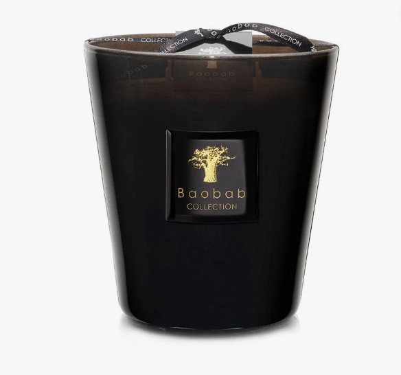 A black Baobab Les Prestigieuses Encre De Chine candle featuring a gold tree logo and text on the front, topped with a ribbon bow.