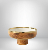 The Madera Footed Bowl by PAMPA BAY features a rustic wood design, round shape, pedestal base, and gold-toned rim, displayed against a plain light gray background.