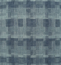 A close-up of D.V. KAP / Canaan Company’s Inlay Pillow Denim shows blue textured fabric with a woven geometric checkerboard design in varied shades of blue.