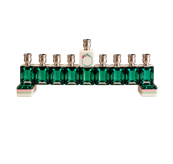 Eclectic Judaica Mah Jong Menorah - Green Emerald, a nine-branched menorah featuring emerald green glass tiles as the base, topped with silver candle cups and a central white tile with a floral detail.