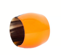 The Horn Napkin Ring Set of 4 by Von Gern Home features wide, glossy orange rings crafted from natural horn with smooth, rounded exteriors and shiny dark brown interiors, shown against a white background.