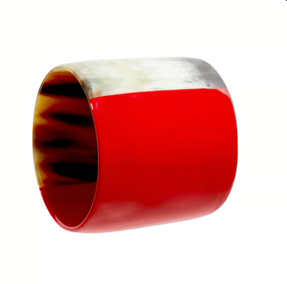 The Horn Napkin Ring Set of 4 by Von Gern Home features wide, smooth rings with bold glossy red accents and marbled natural horn patterns in shades of brown, cream, and white.