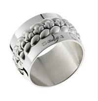 Christofle Babylon Silver Plated Napkin Ring Set 4, featuring a silver-plated finish and a raised, pebbled decorative band around the center.