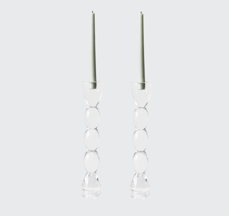 The Lainy Home Crystal Oval Candlesticks Set of 2, made of stacked clear glass spheres and topped with tall pale green candles, are displayed against a light gray background for an elegant, sophisticated look.