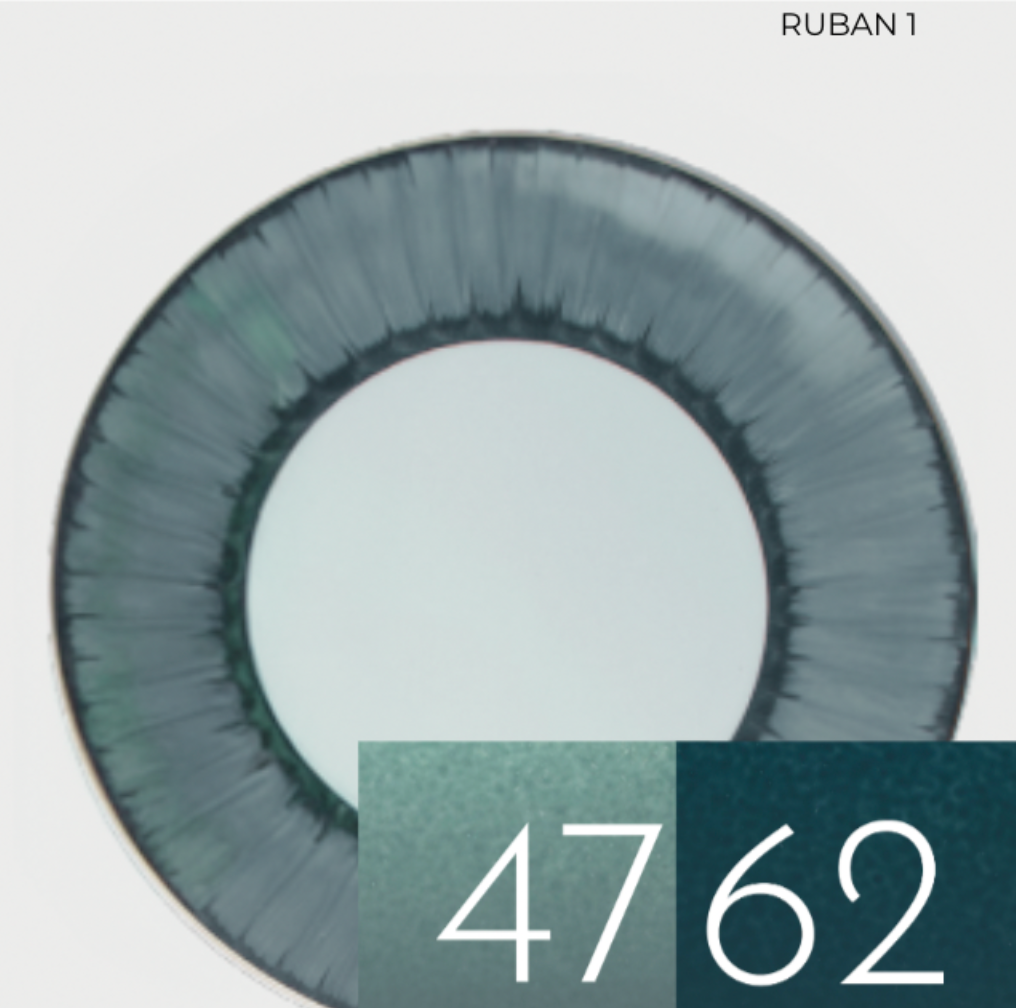 Marie Daâge Ruban 1 Dinnerware features a round plate with a dark green outer rim. At the bottom right, two overlapping green swatches, numbered 47 and 62, capture the hand-painted elegance of fine Limoges porcelain.
