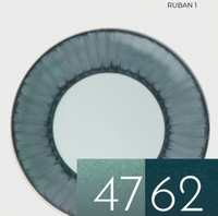 Marie Daâge Ruban 1 Dinnerware features a round plate with a dark green outer rim. At the bottom right, two overlapping green swatches, numbered 47 and 62, capture the hand-painted elegance of fine Limoges porcelain.