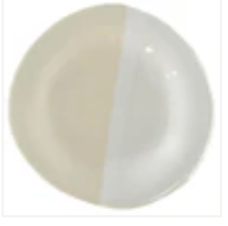 The Urban Dinnerware - Custom plate by Alex Marshall Studios is a round handmade stoneware piece with an organic, half-beige, half-white design. It's microwave and dishwasher safe.