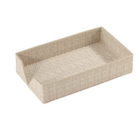 The Bodrum Wicker Guest Towel Holder is a rectangular beige basket tray with a partially lowered side and woven design for easy access, shown on a white background.