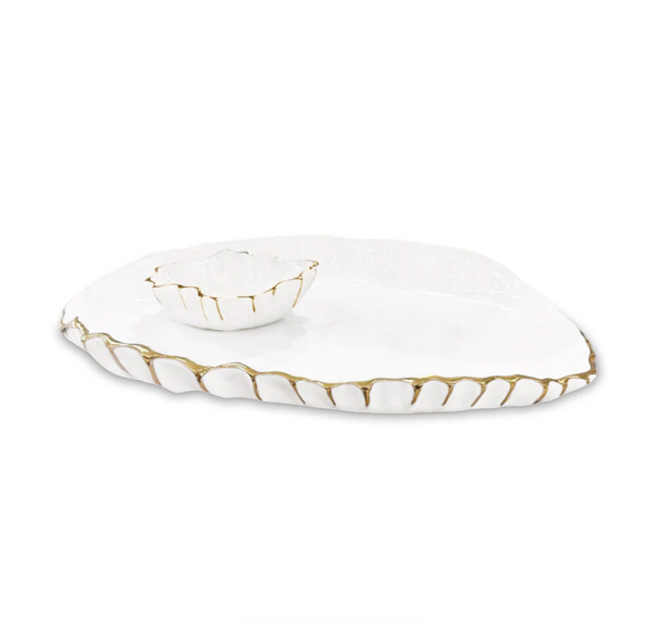 The Beatriz Ball Thanni Mystic Oval Platter w/ Bowl White & Gold - Large is a handcrafted serving piece with uneven edges, gold trim, and a matching small bowl placed on top.