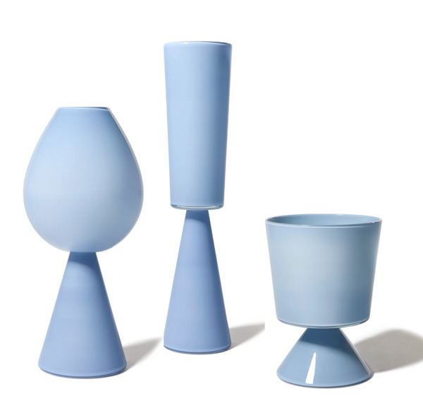 The Fiorelli Collection Vase - Dove - by Cariati features a modern, minimalist blue ceramic design with geometric cylindrical and conical forms, arranged to create unique, abstract sculptural silhouettes reminiscent of glass vases.